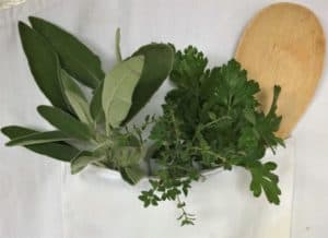 cook's apron pocket full of herbs