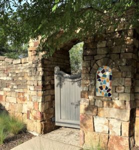 rustic gate detail from a family neighborhood wall