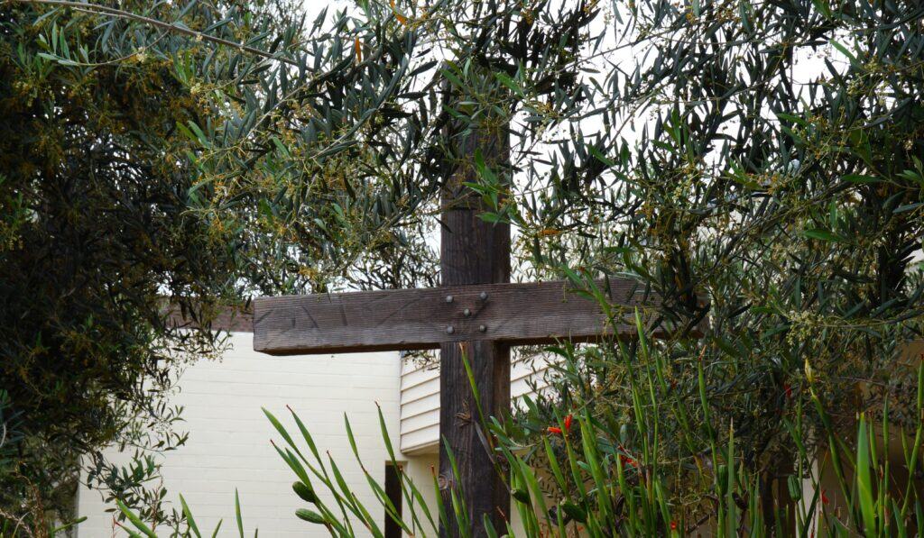 wooden cross in a California church garden